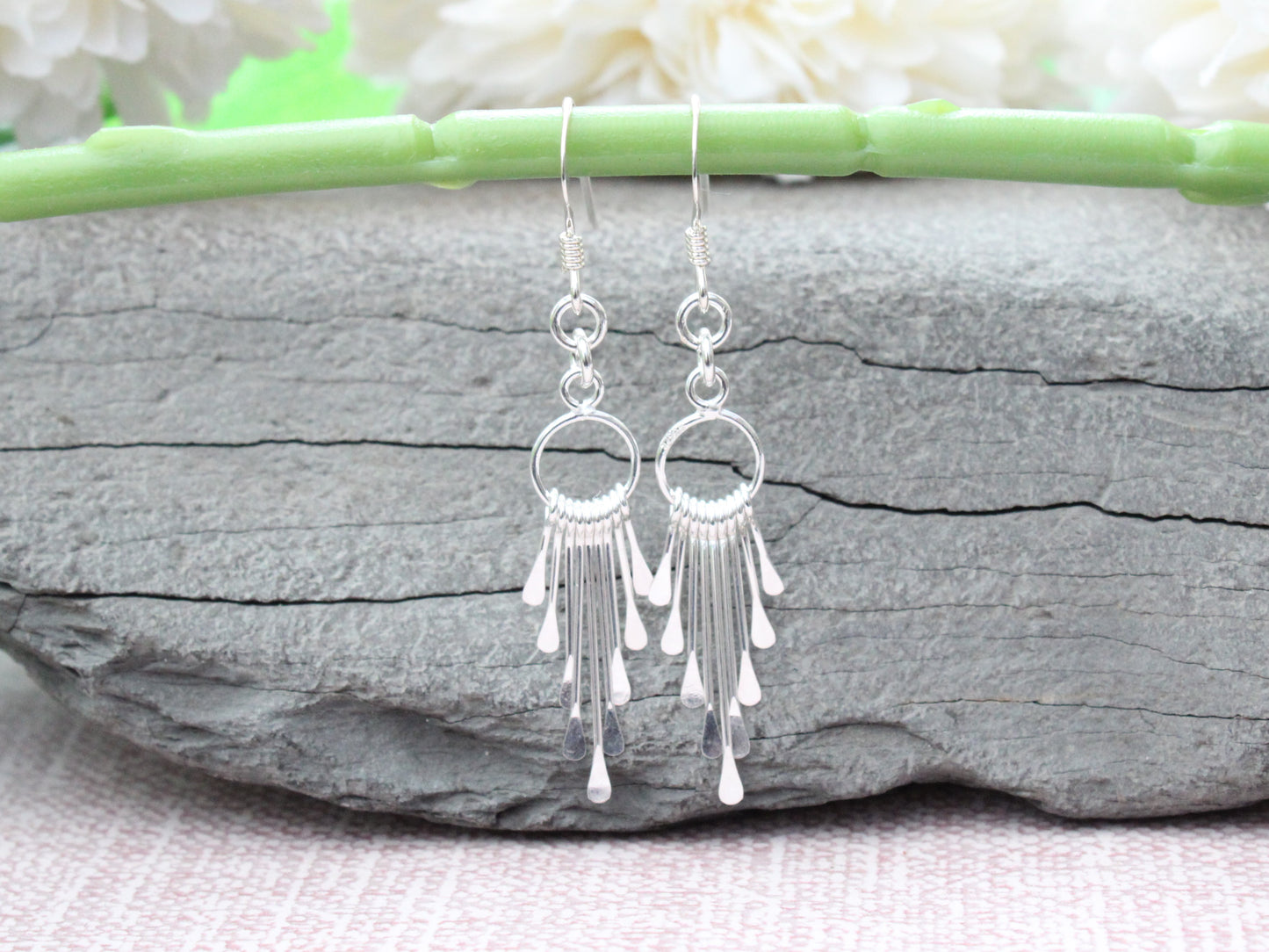 Silver tassel earrings.