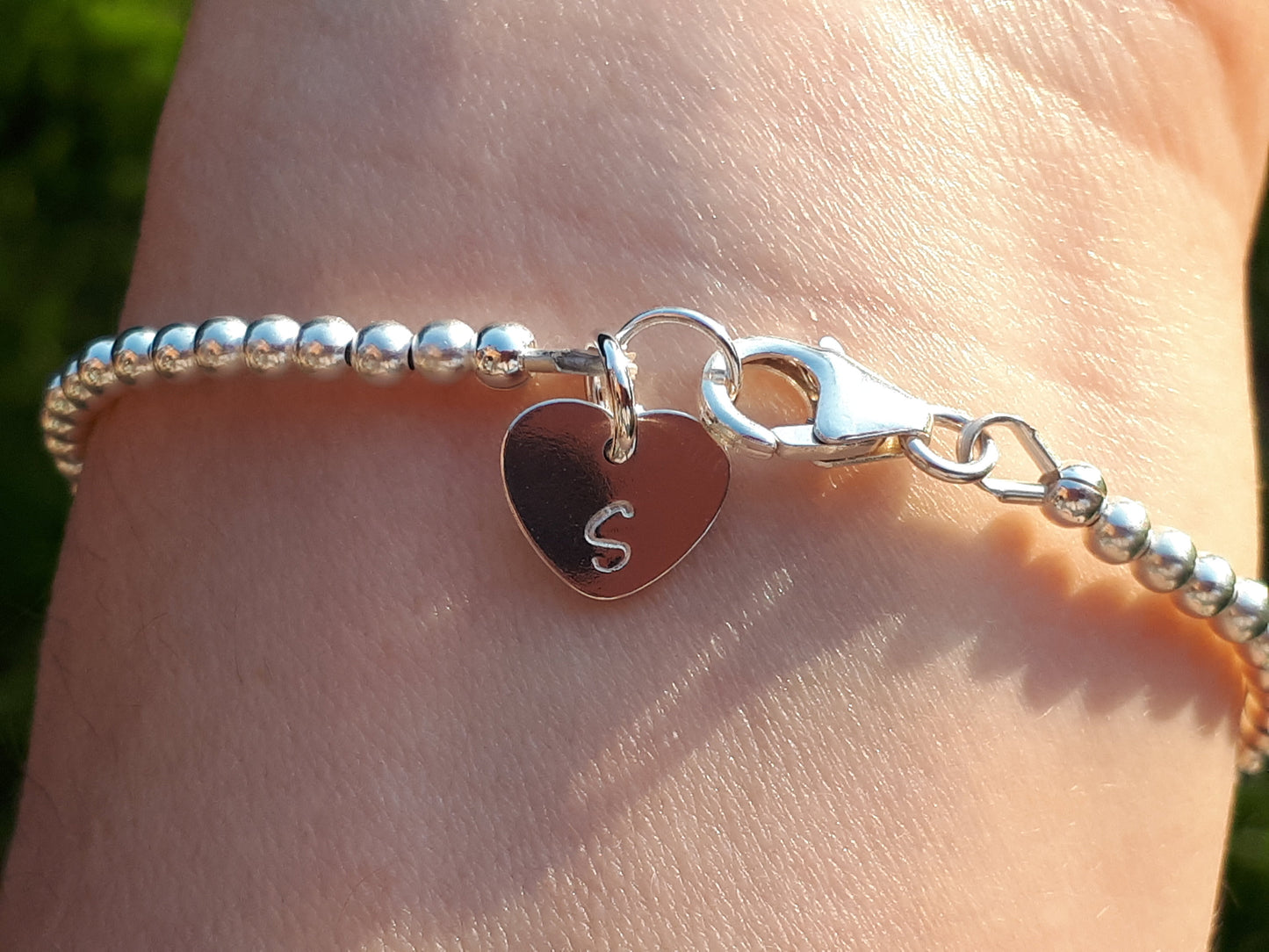 Ruby bracelet sterling silver with optional personalised initial tag. July birthstone bracelet.