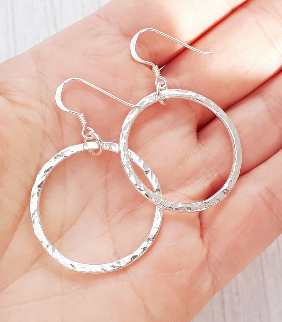 Pearl hoop earrings in sterling silver.