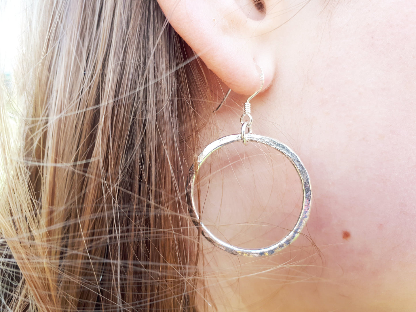 Pearl hoop earrings in sterling silver.