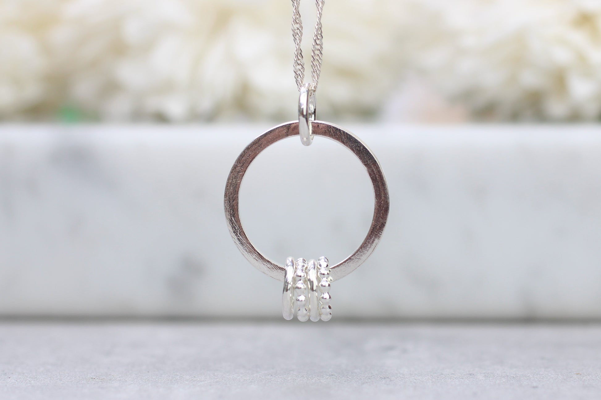 40th birthday ring necklace with 4 smaller rings