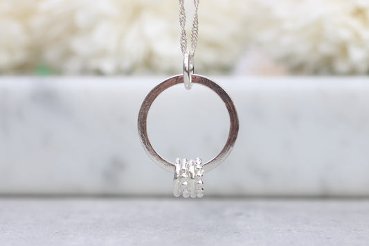 40th birthday ring necklace with 4 smaller rings
