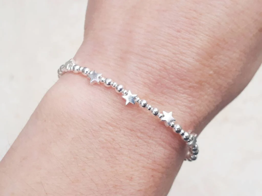 60th birthday bracelet. 60th birthday gift. Sterling silver star bracelet with slider clasp.