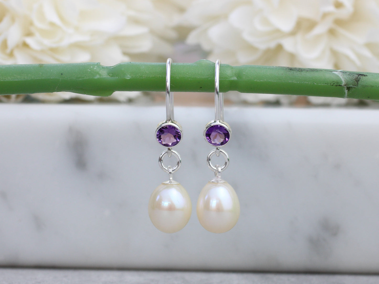 Amethyst and pearl drop earrings.