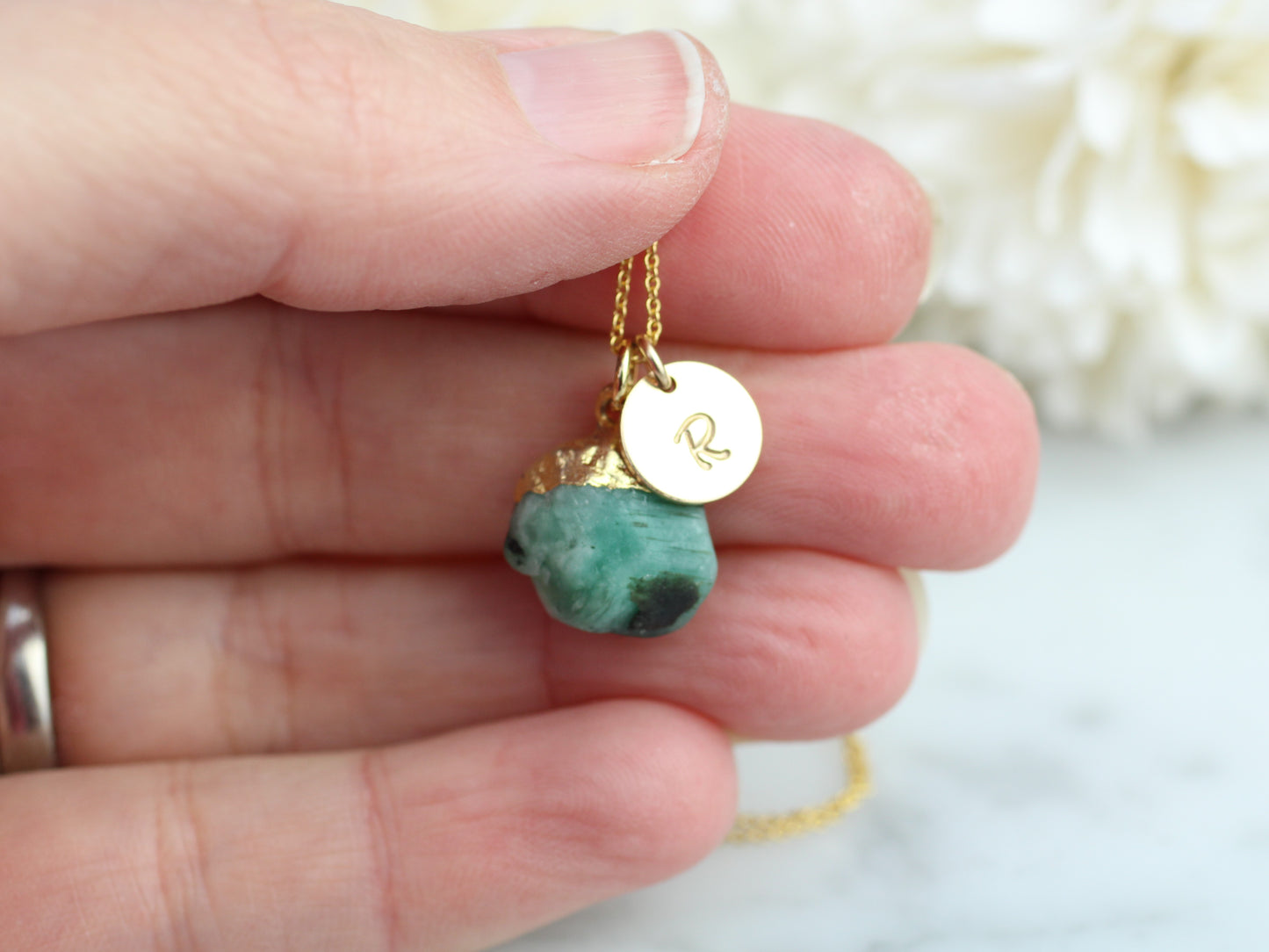 Personalised emerald necklace in gold.