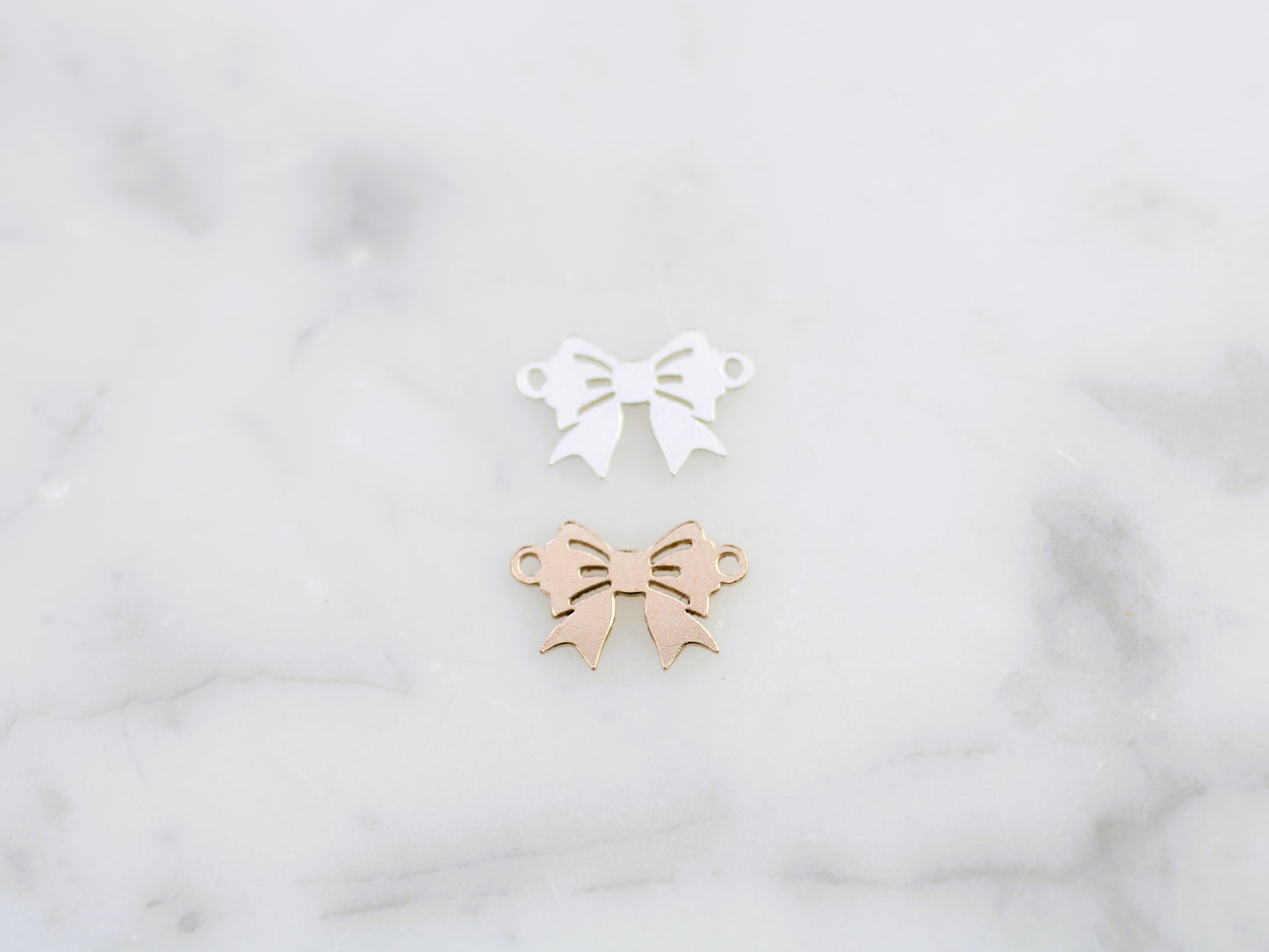 Bow connector in sterling silver or gold filled.