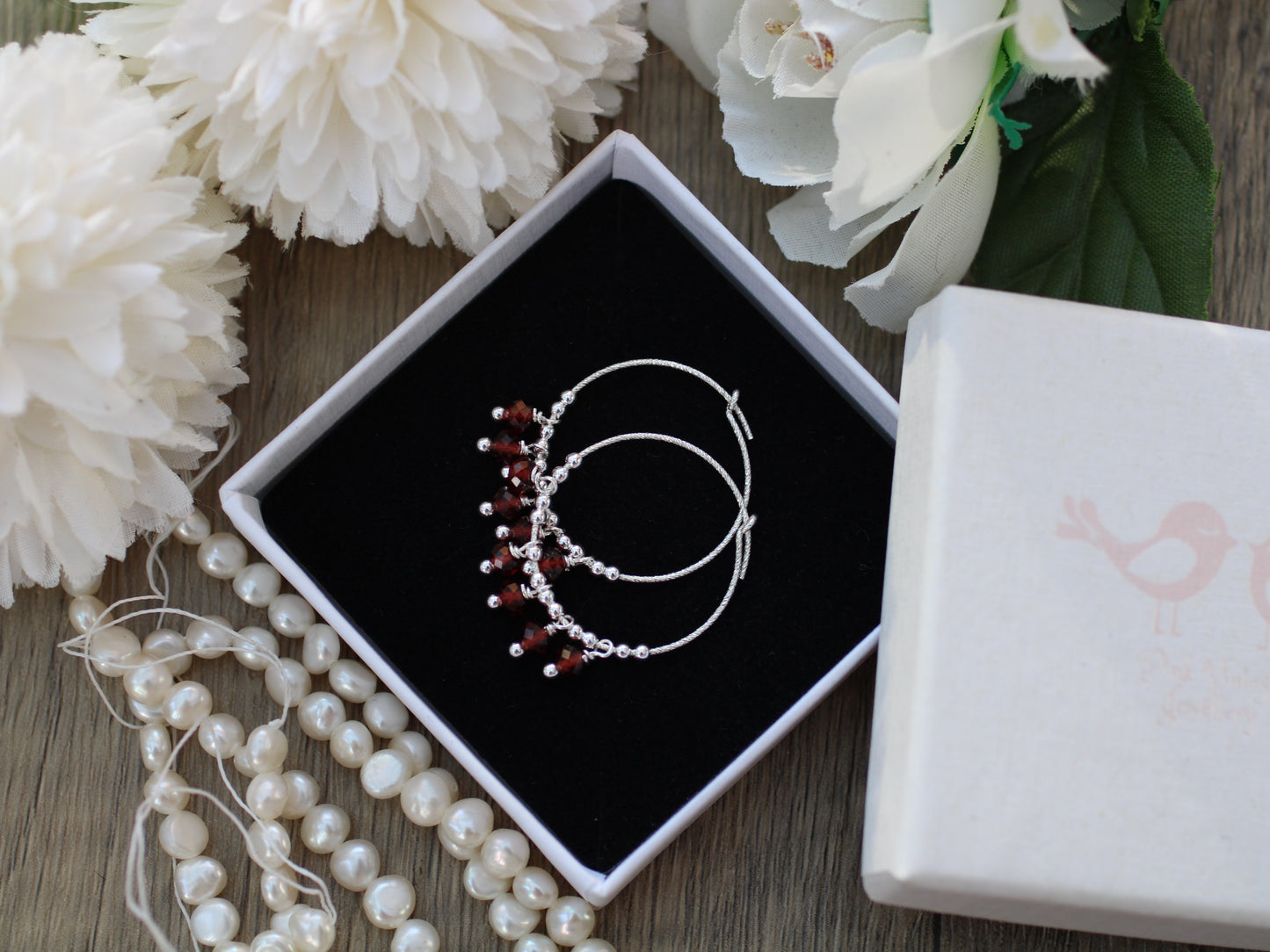 Sparkly garnet hoop earrings.