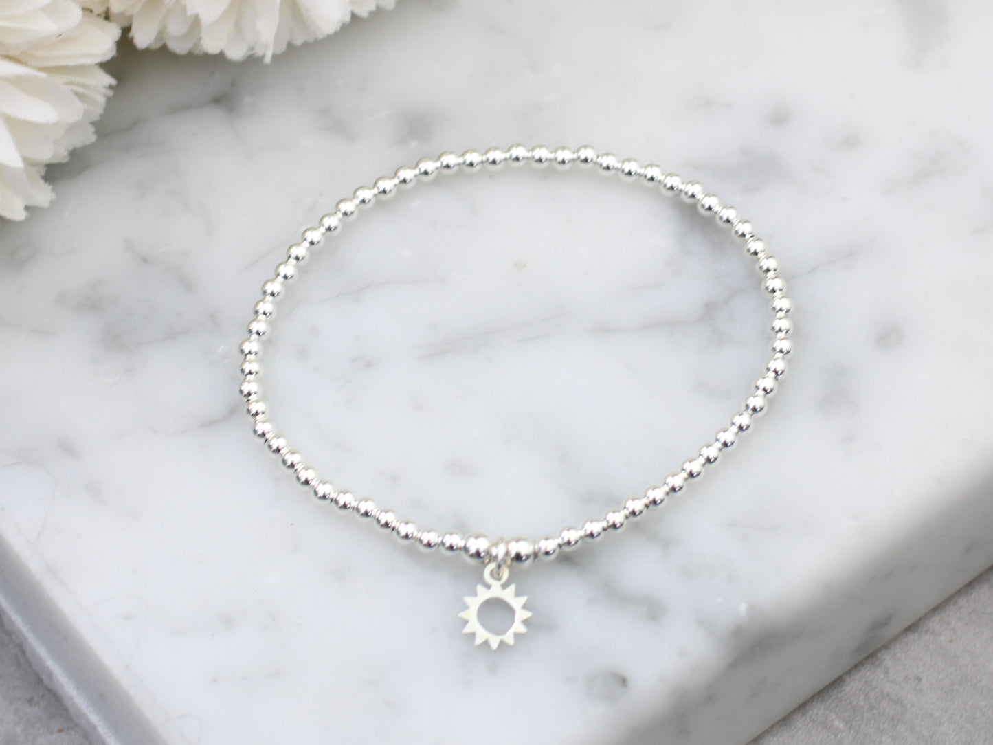 Sun charm bracelet.