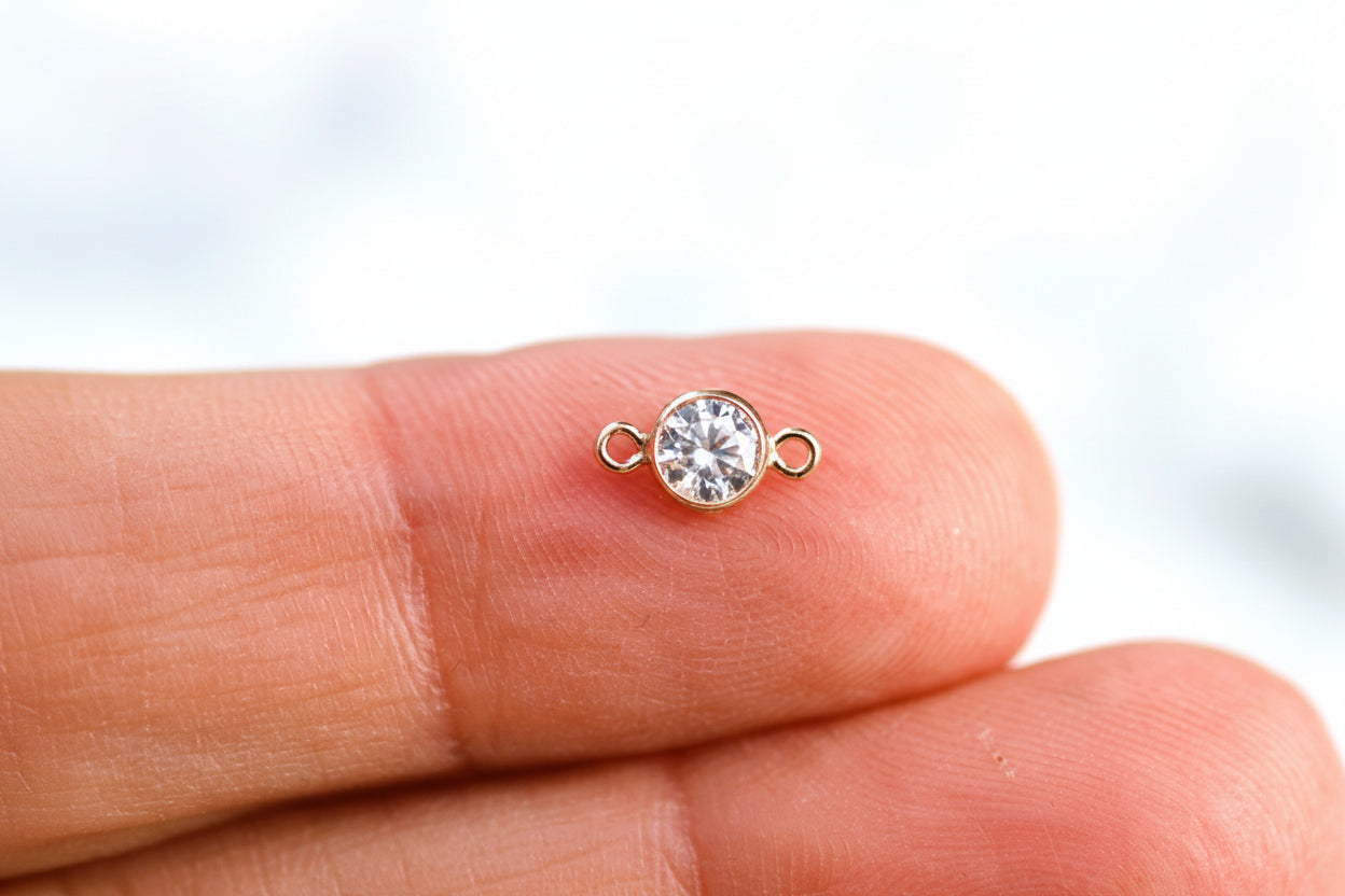 Rose gold crystal connector.