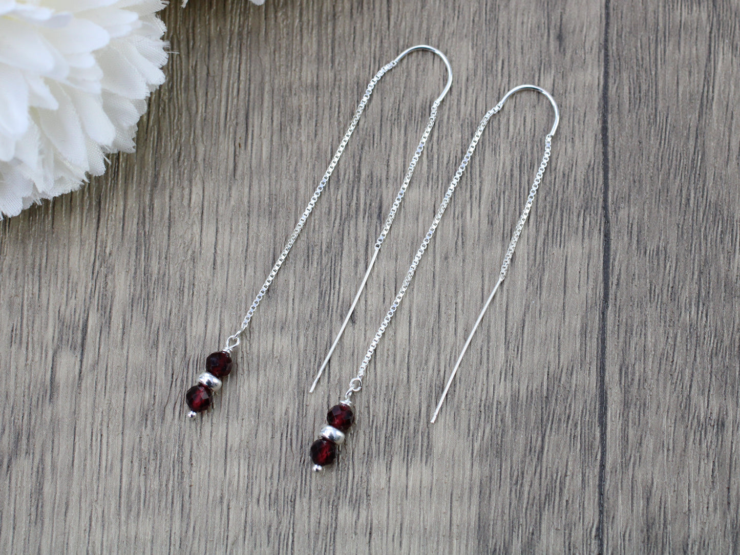 Garnet thread through earrings in sterling silver.