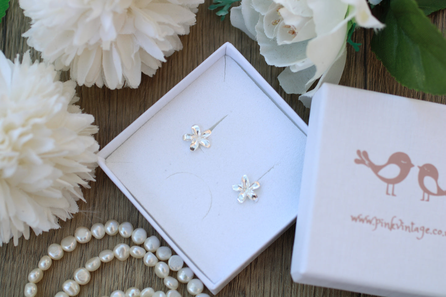 Handmade Sterling Silver Frangipani stud earrings.
