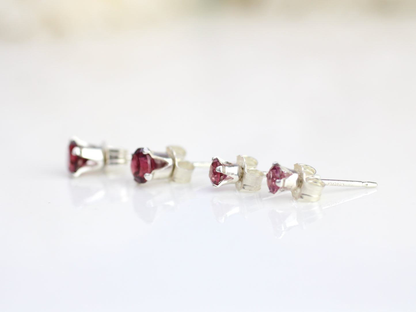 Rhodolite garnet stud earrings in silver or gold.