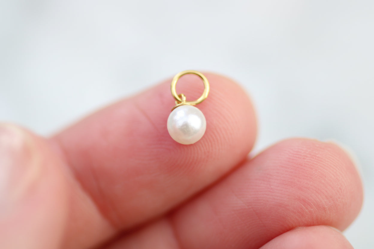 Gold filled faux pearl charm.