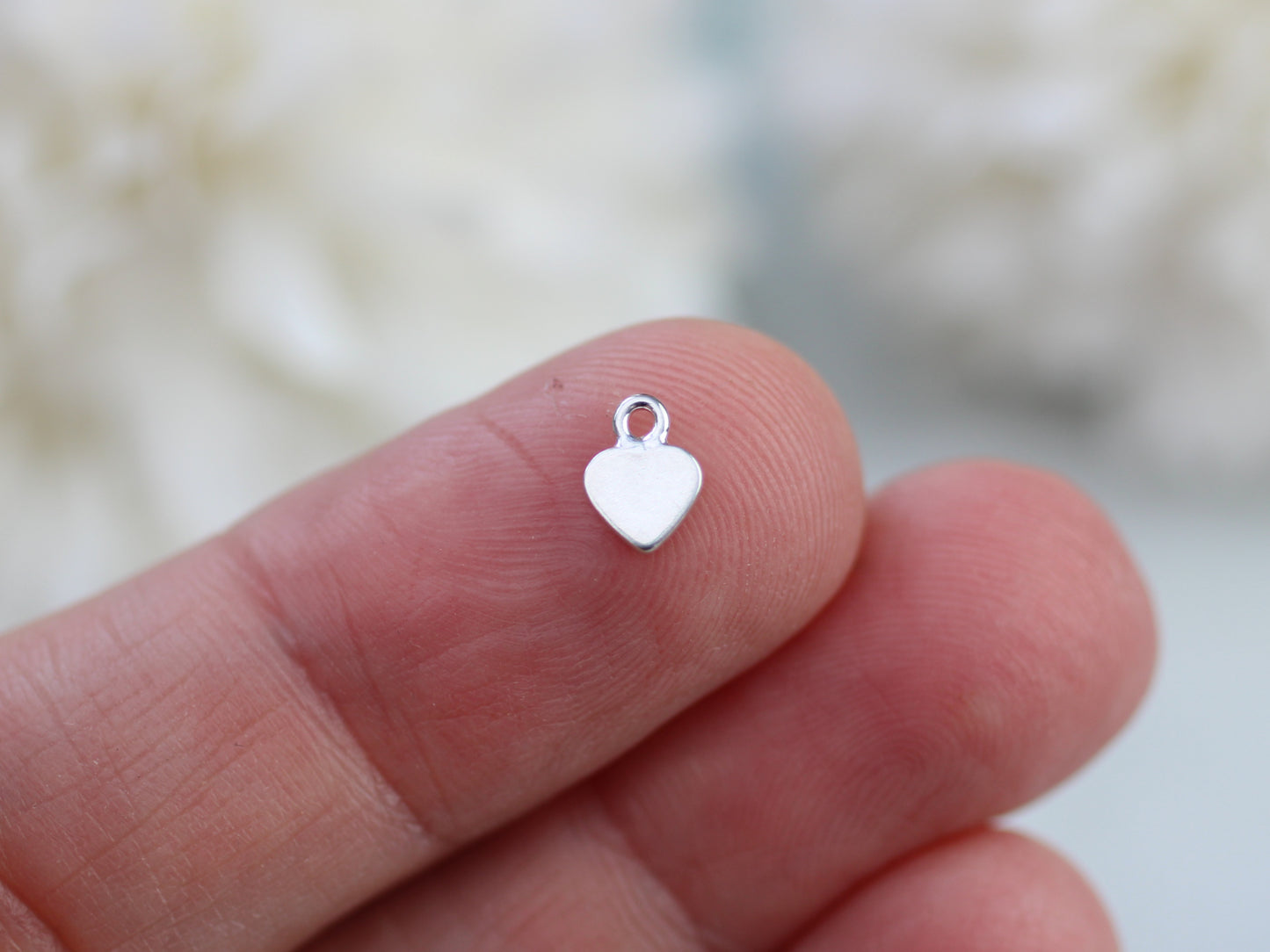 Tiny personalised heart charm.