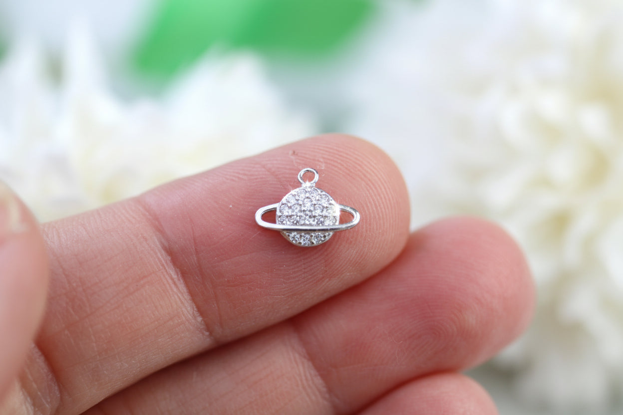 Sparkly planet charm.