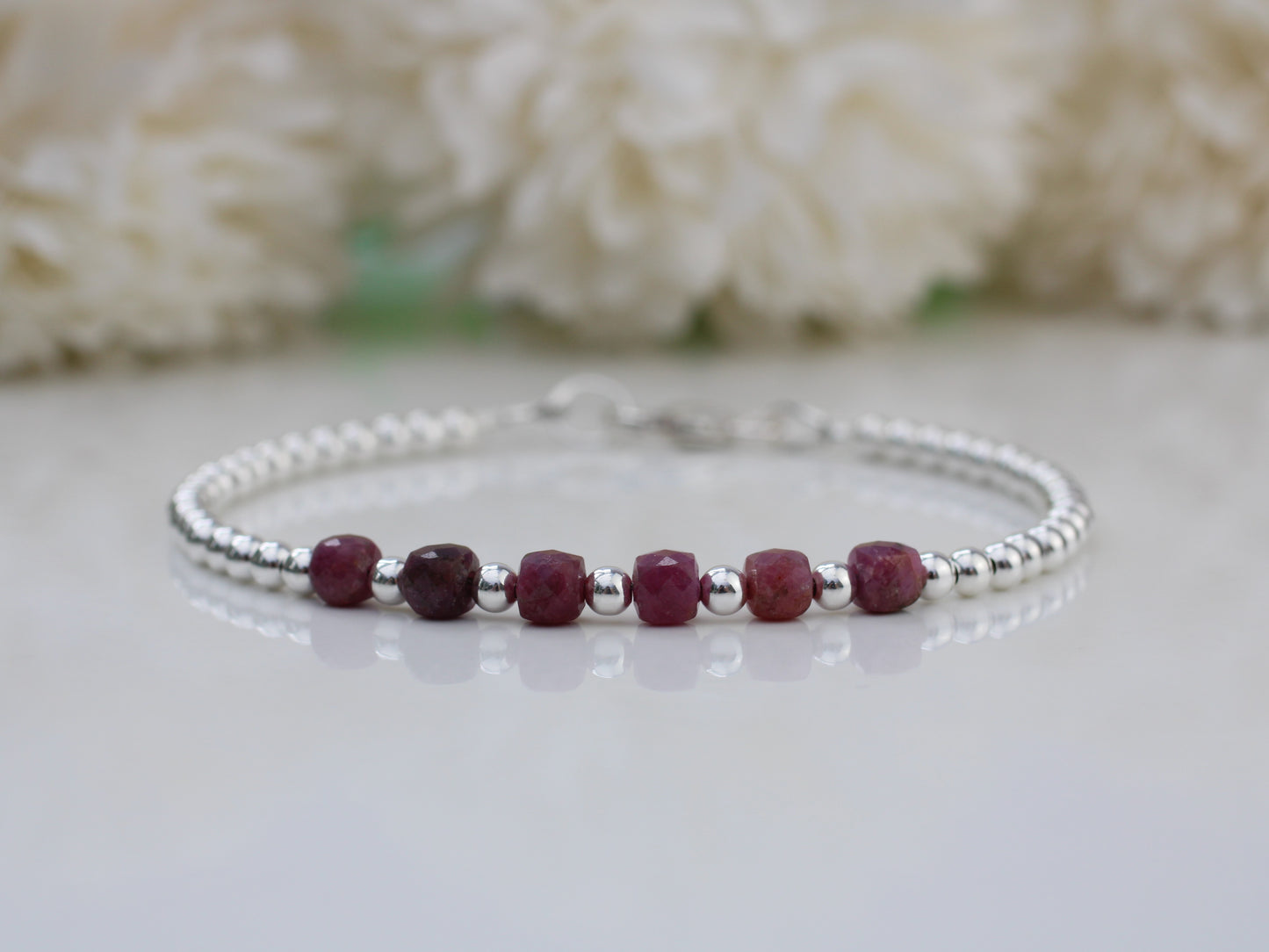 Ruby milestone bracelet in sterling silver.