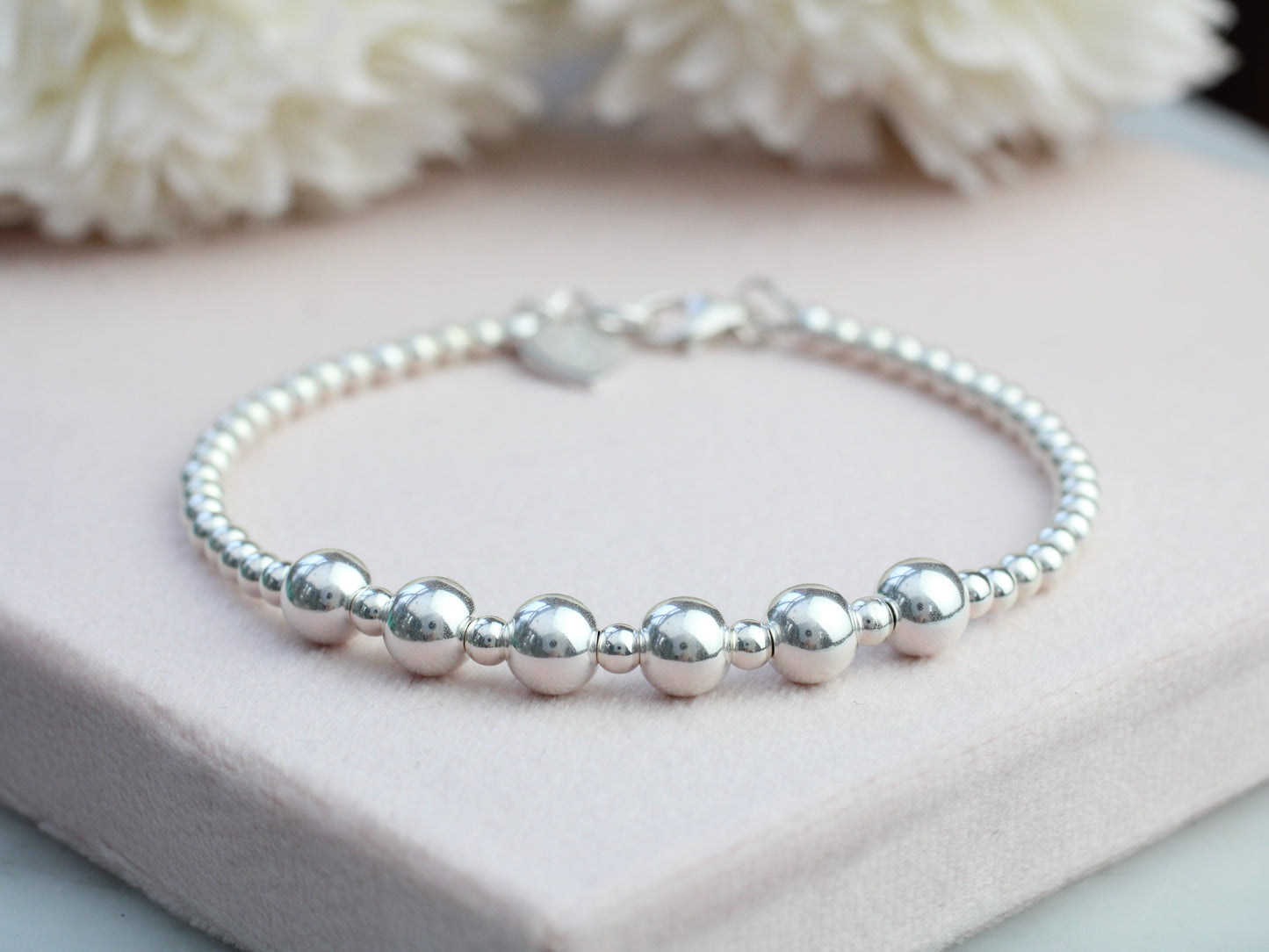 Sterling silver bead bracelet for 60th birthday.