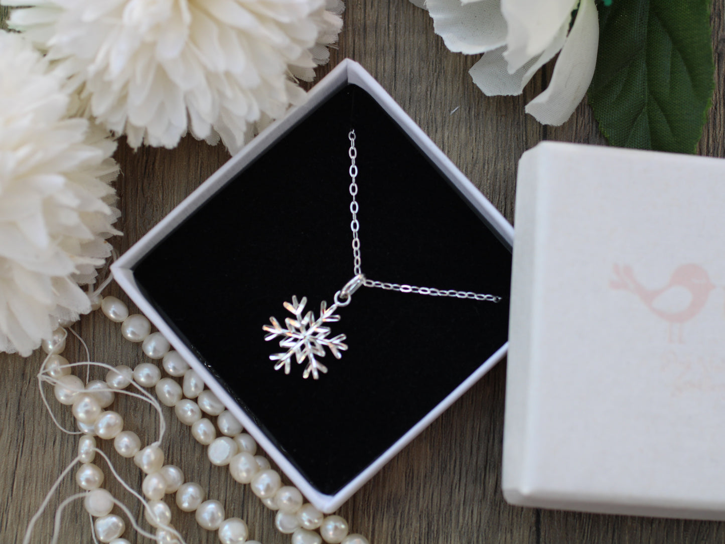 Diamond cut snowflake pendant necklace.