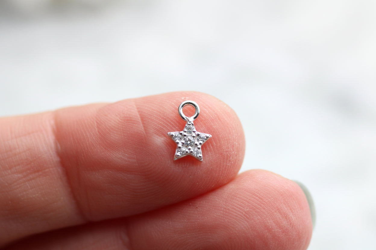Mini sparkly star charm.