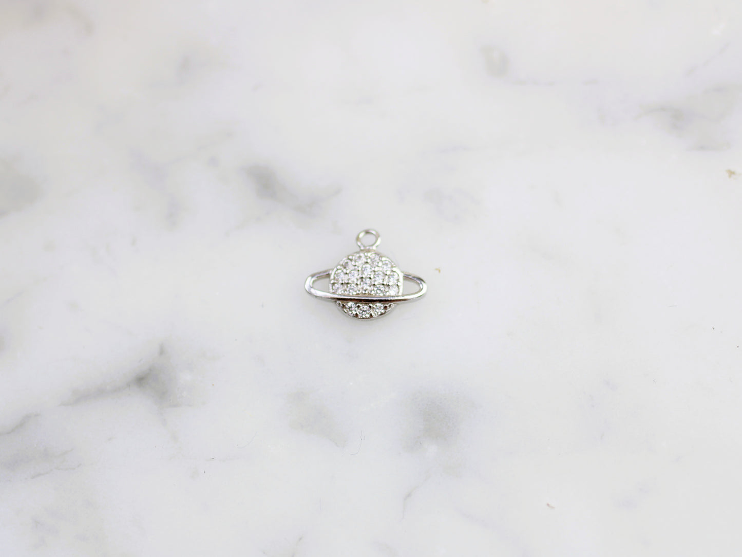 Sparkly planet charm.