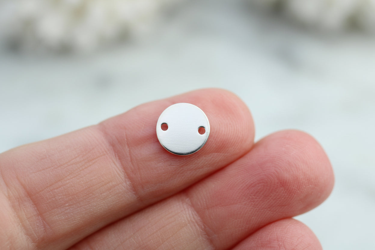 Personalised silver round connector.