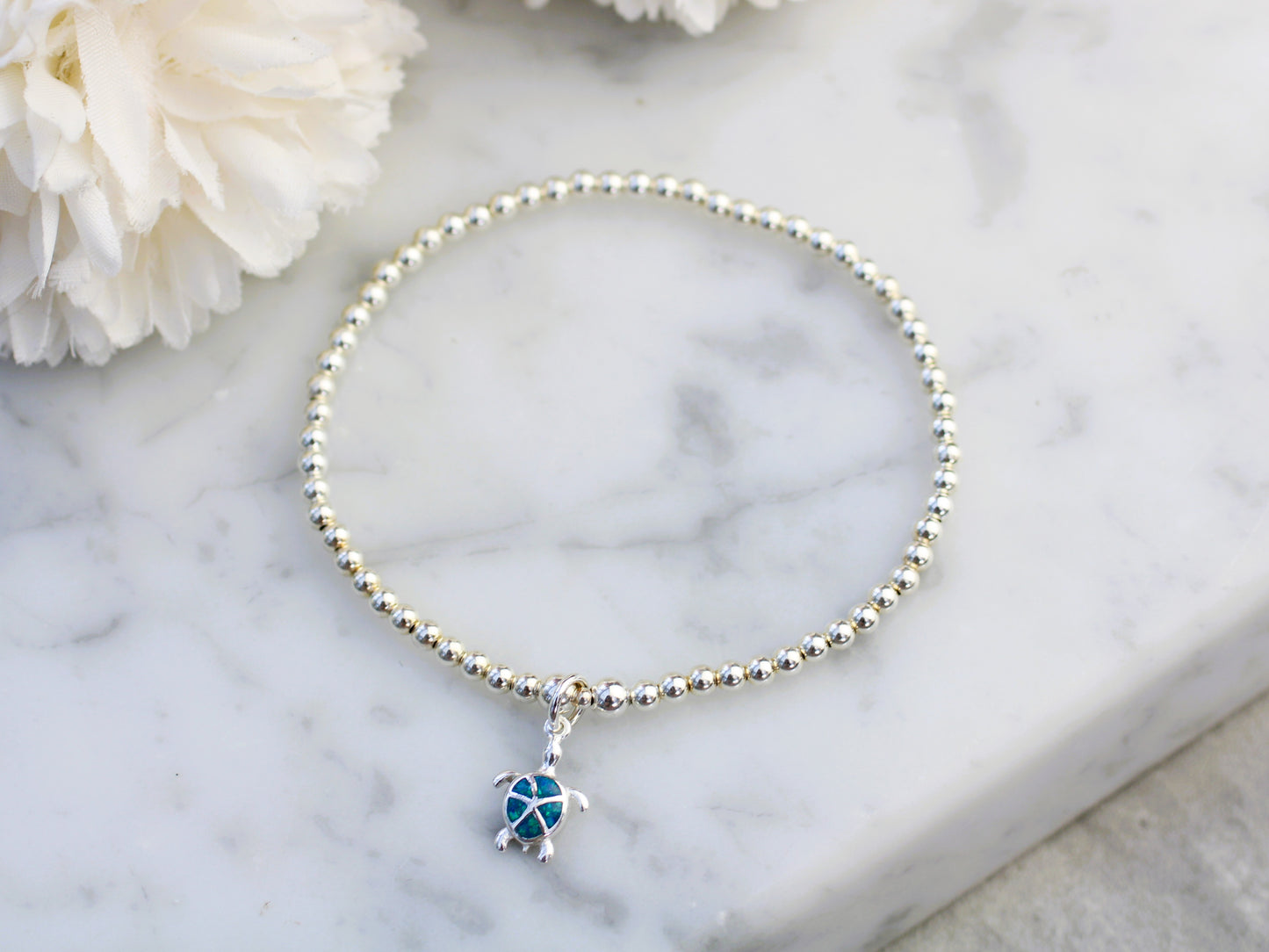 Blue opal turtle charm bracelet.