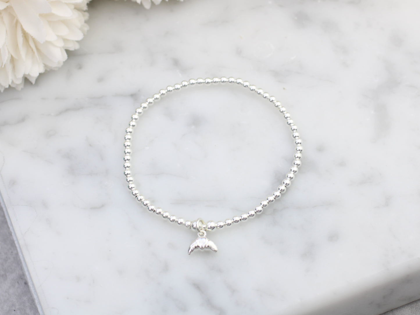 Croissant charm bracelet.