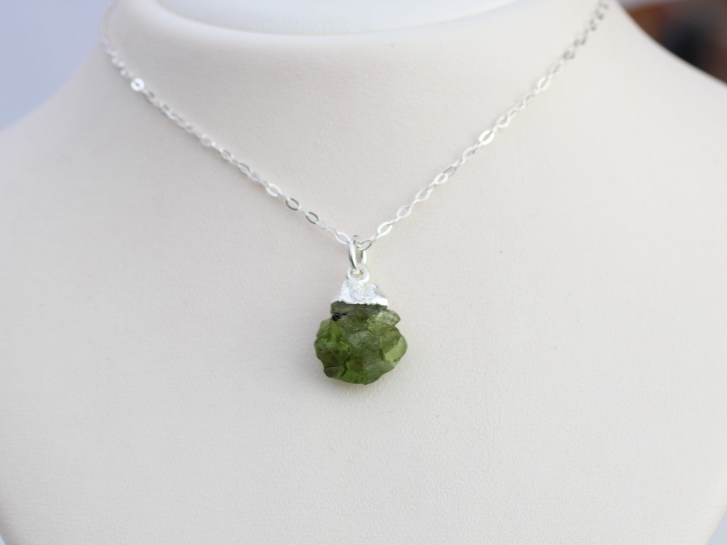 Raw peridot necklace in silver. August birthstone.
