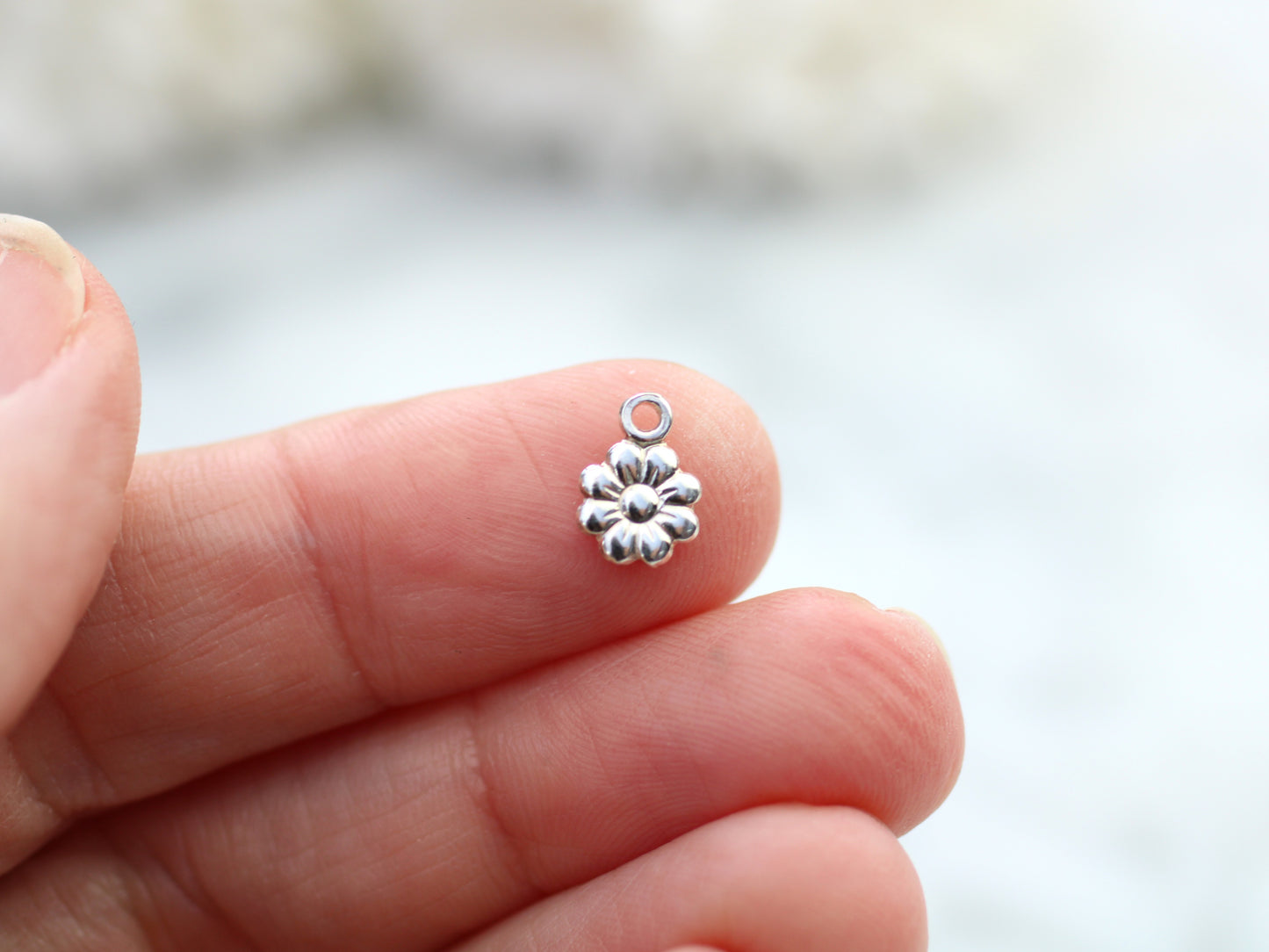 Small daisy charm.