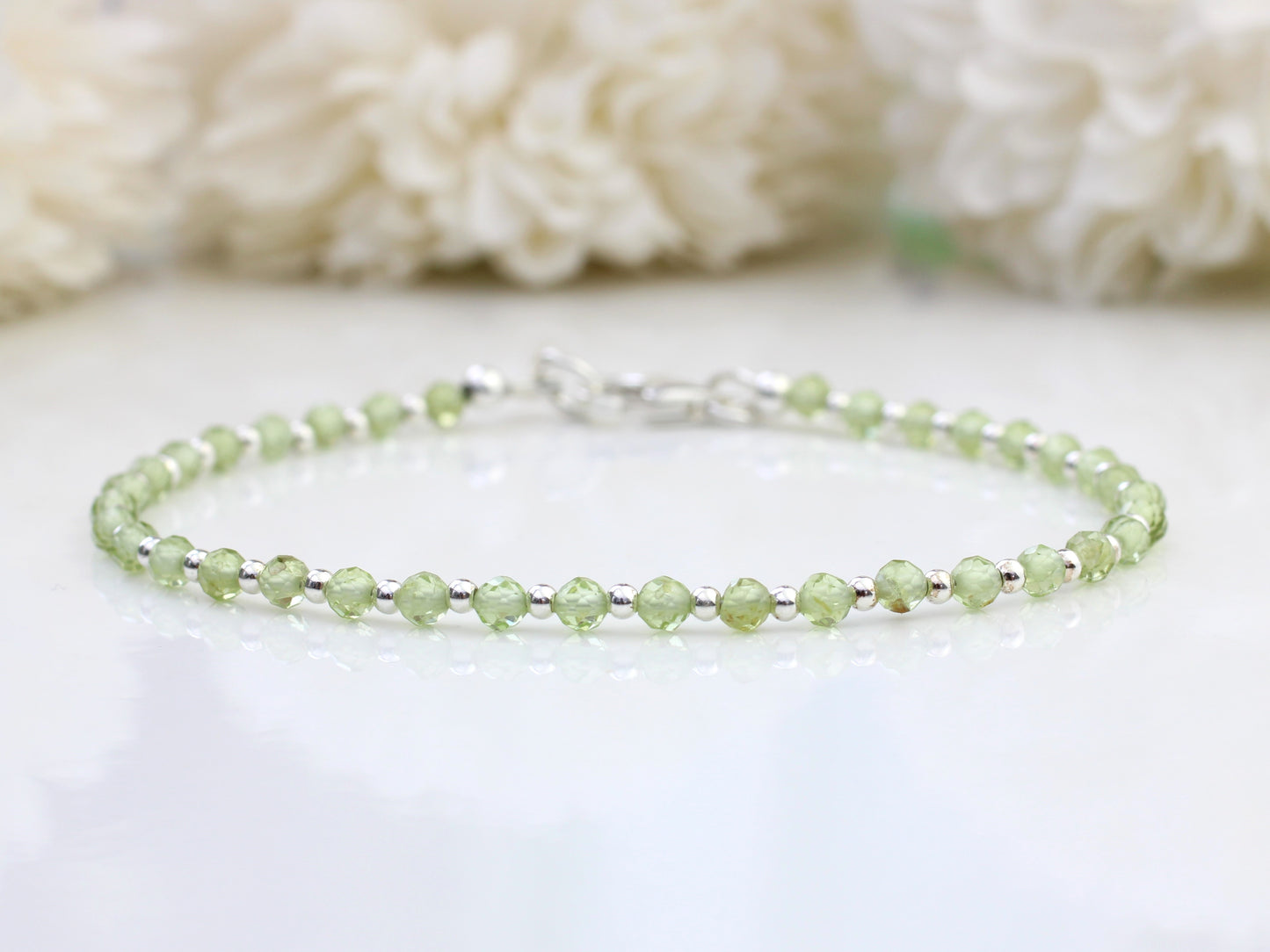 Personalised peridot bracelet in sterling silver.