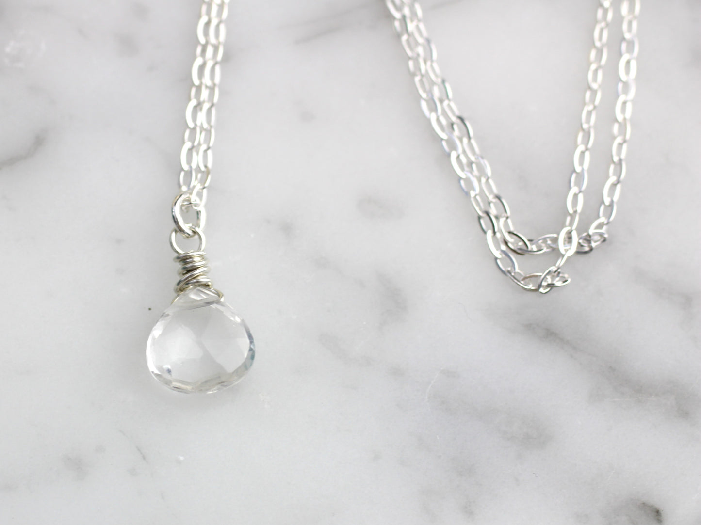 Clear quartz necklace in silver or gold.
