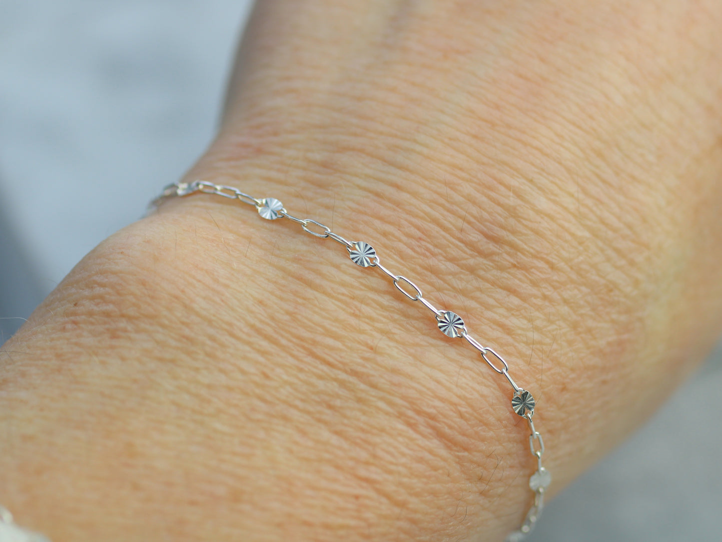 Dainty starburst bracelet in silver or gold filled.