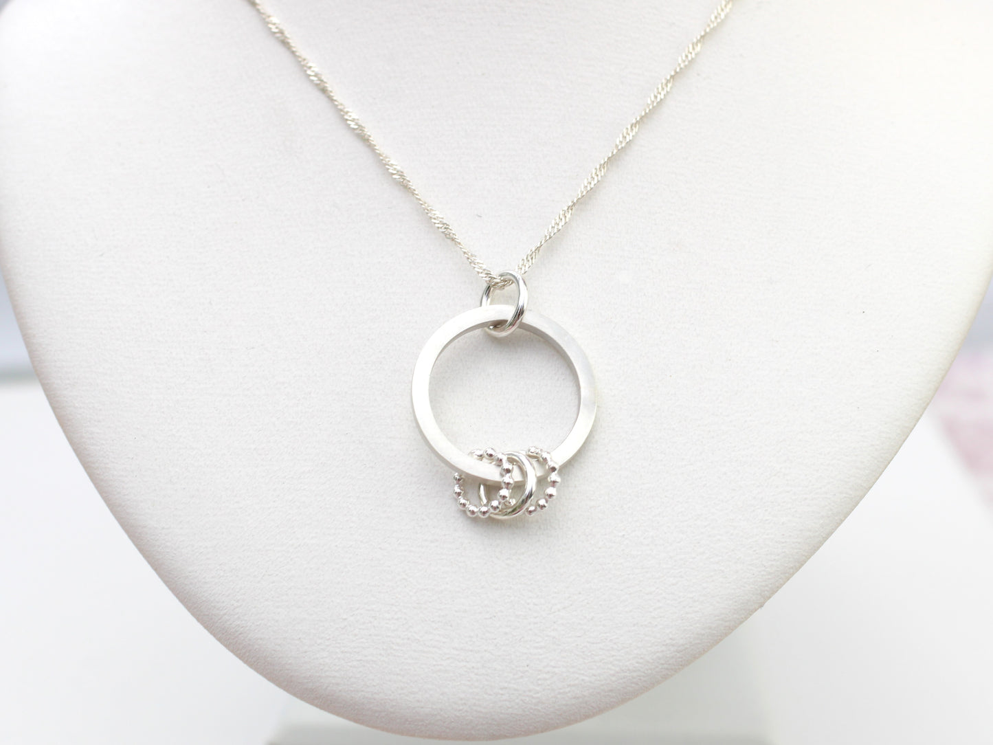 30th birthday necklace with 3 rings.