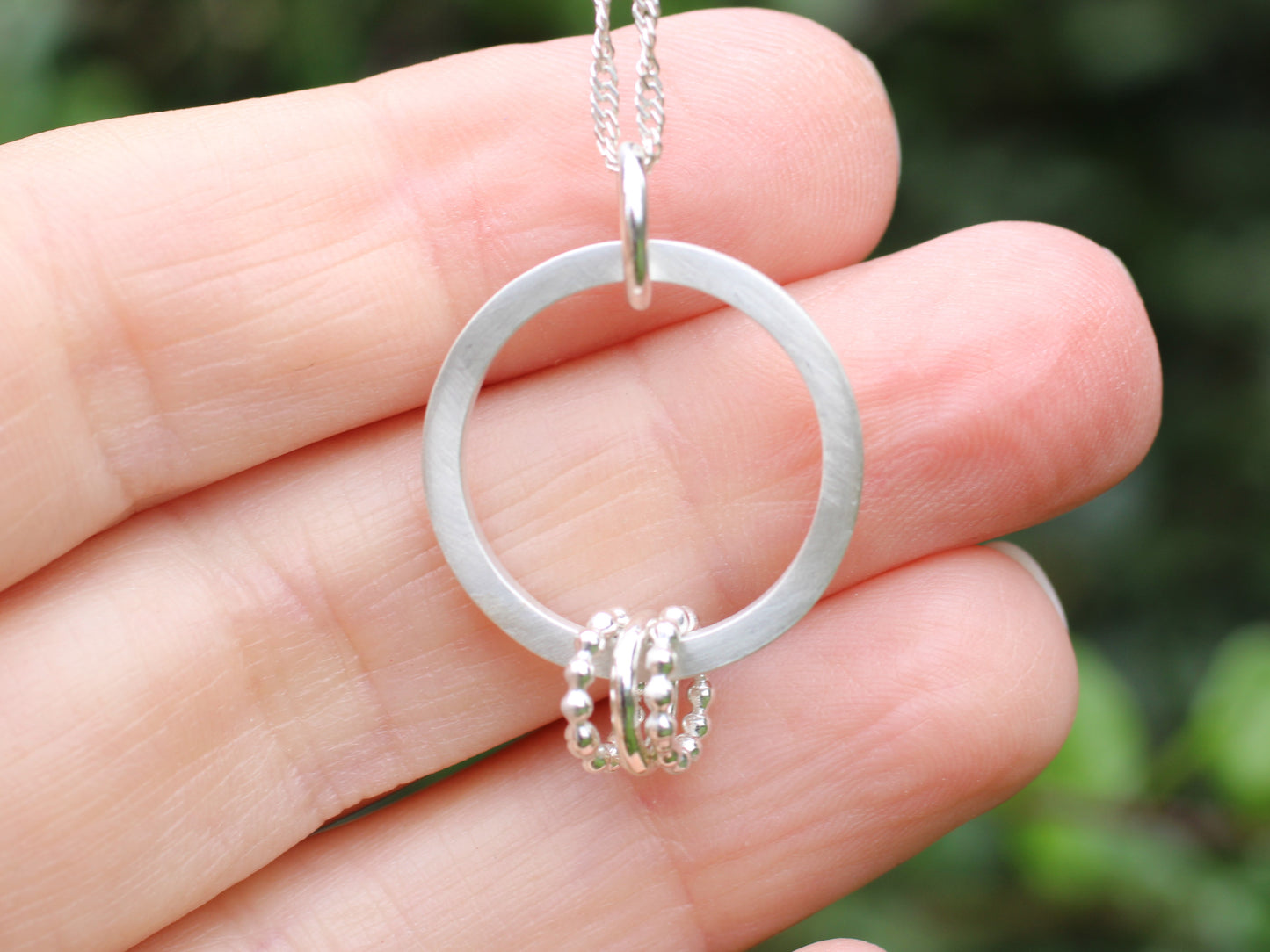 30th birthday necklace with 3 rings.