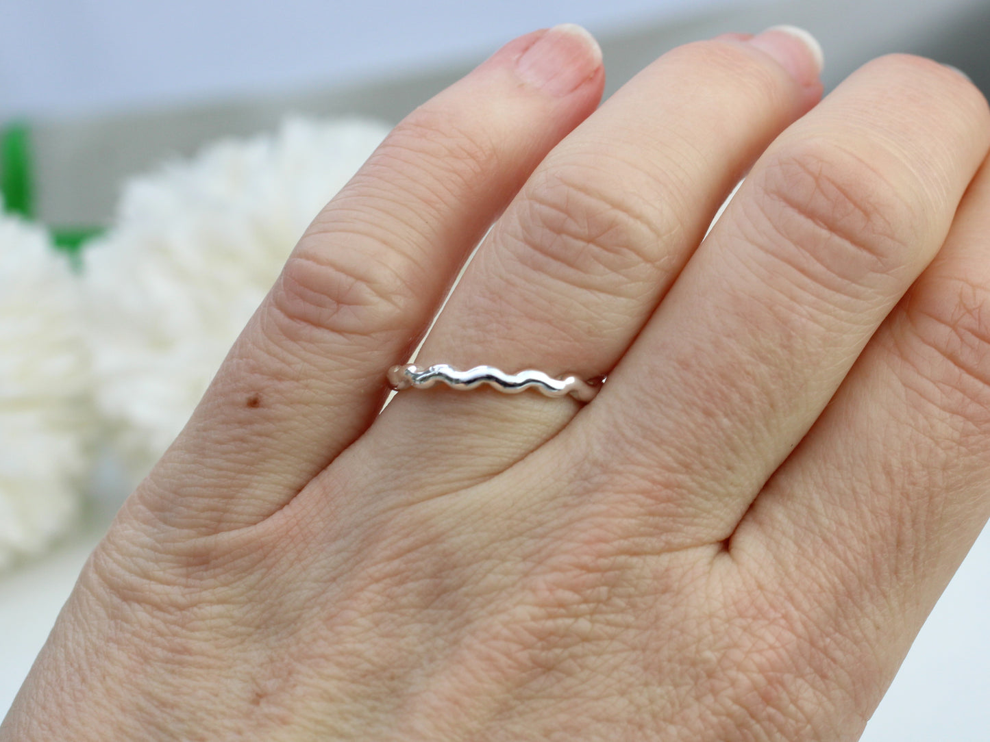 Wavy ring made from recycled sterling silver.