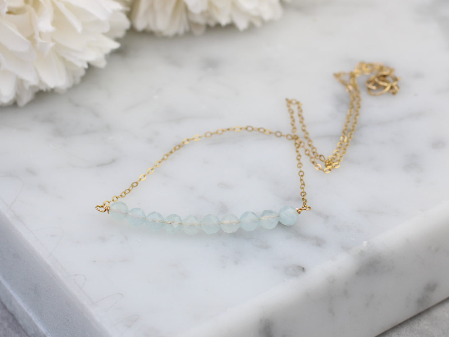 Aquamarine birthstone necklace in silver or gold.
