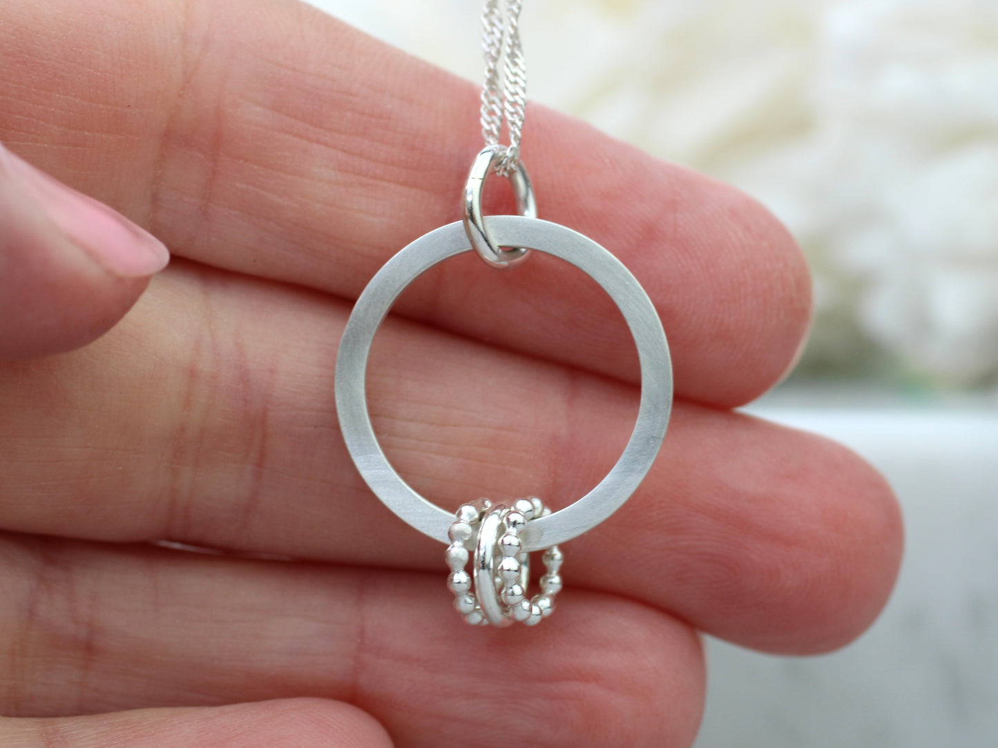 30th birthday necklace with 3 rings.