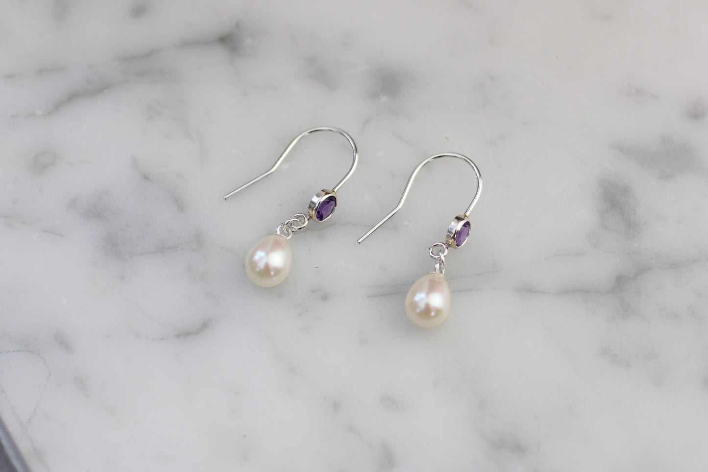 Amethyst and pearl drop earrings.