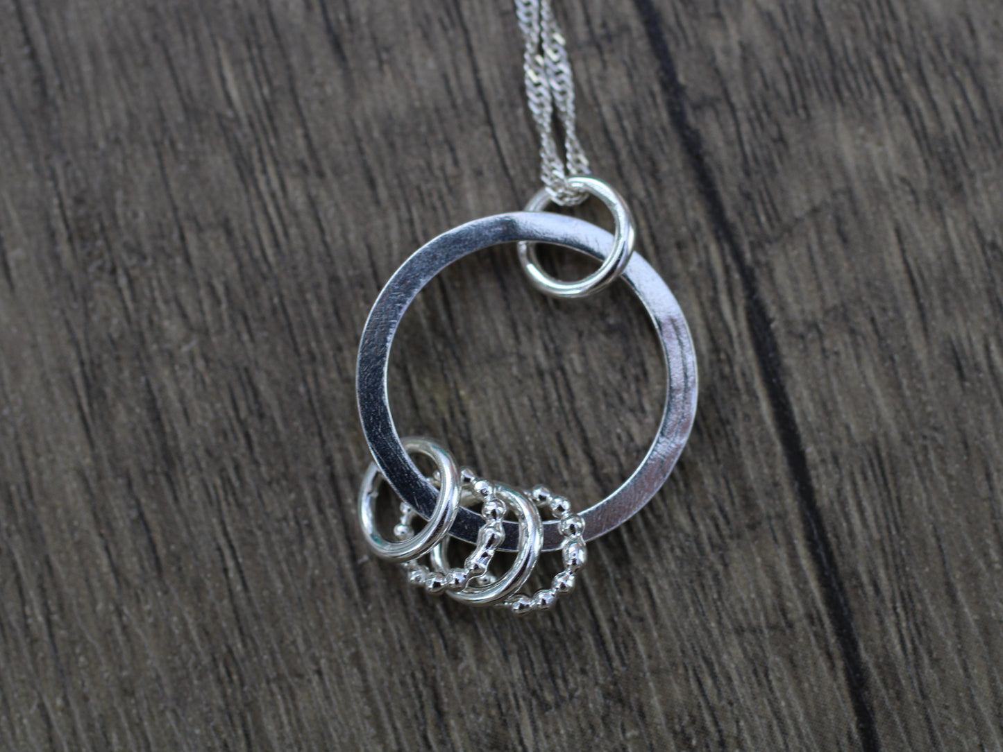 40th birthday necklace with 4 rings.