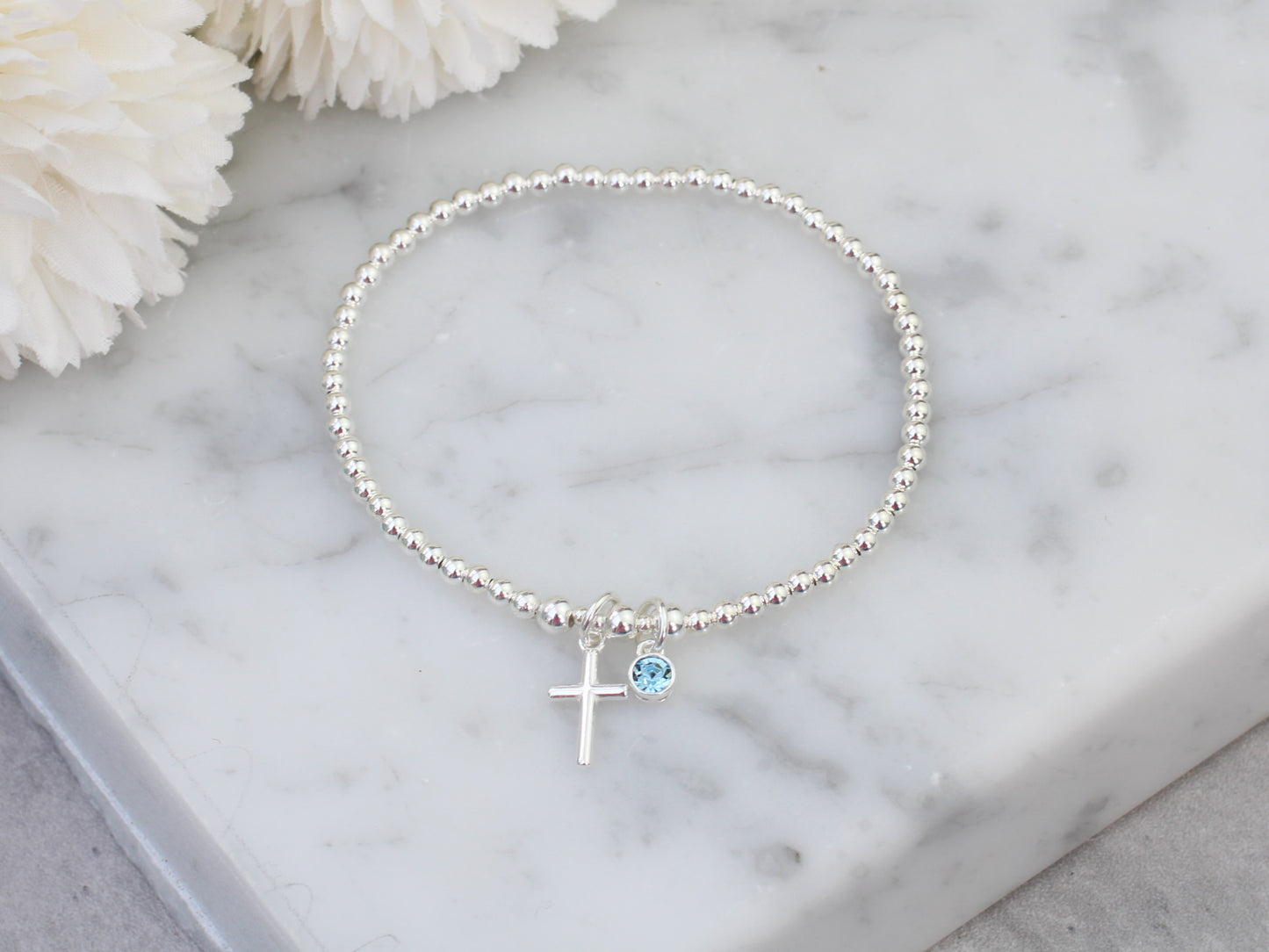 Cross and birthstone charm bracelet.