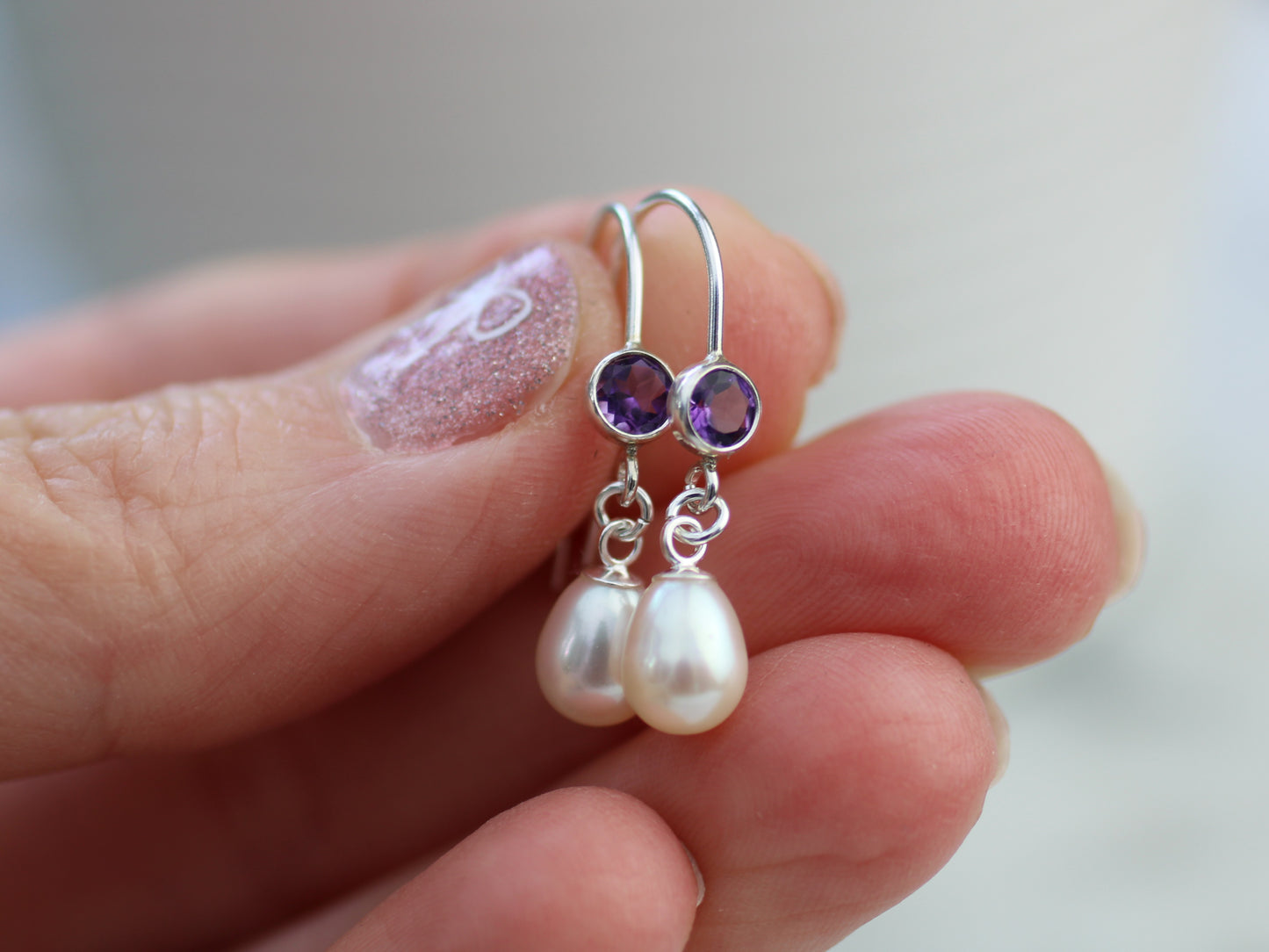 Amethyst and pearl drop earrings.
