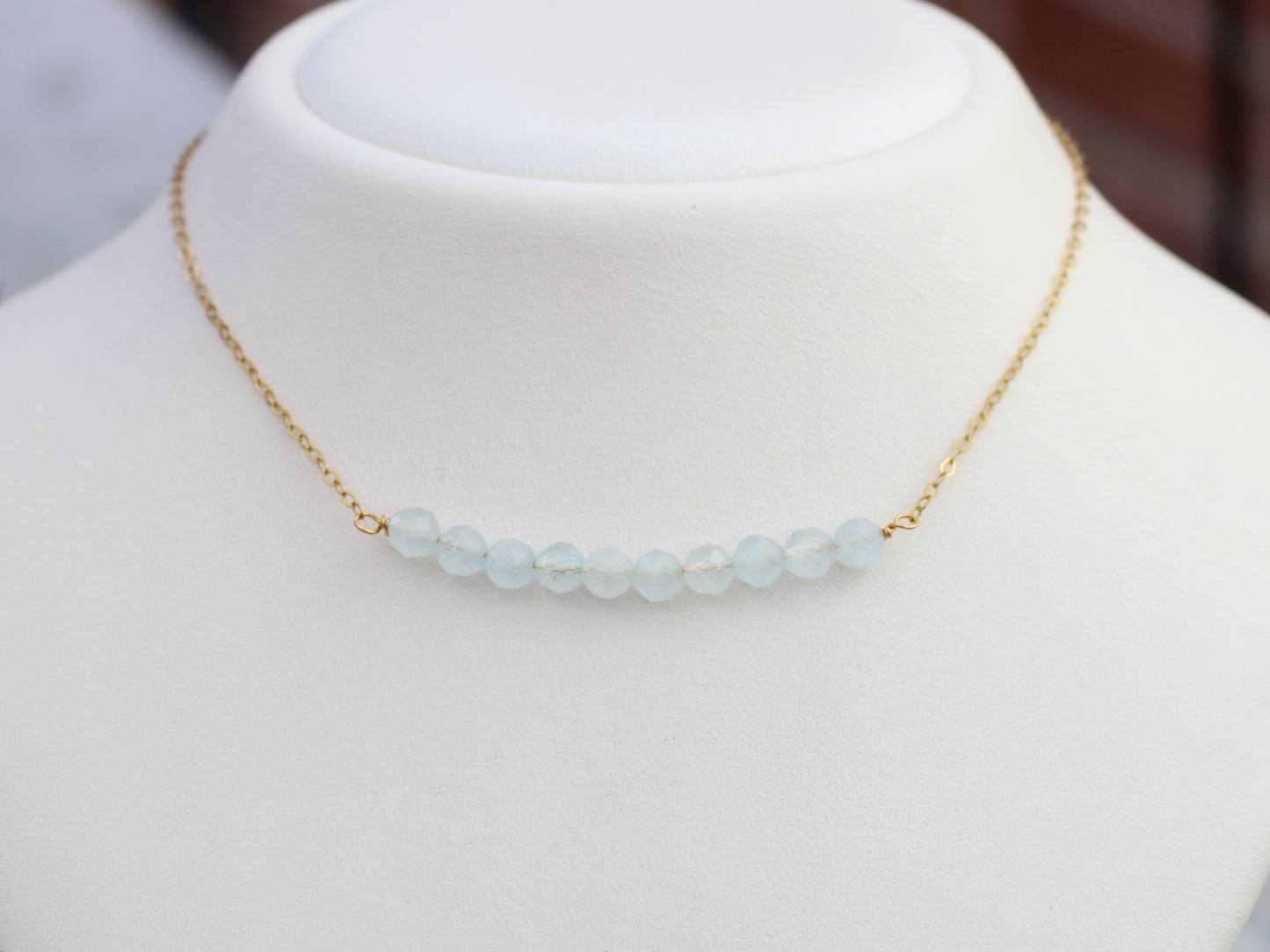 Aquamarine birthstone necklace in silver or gold.