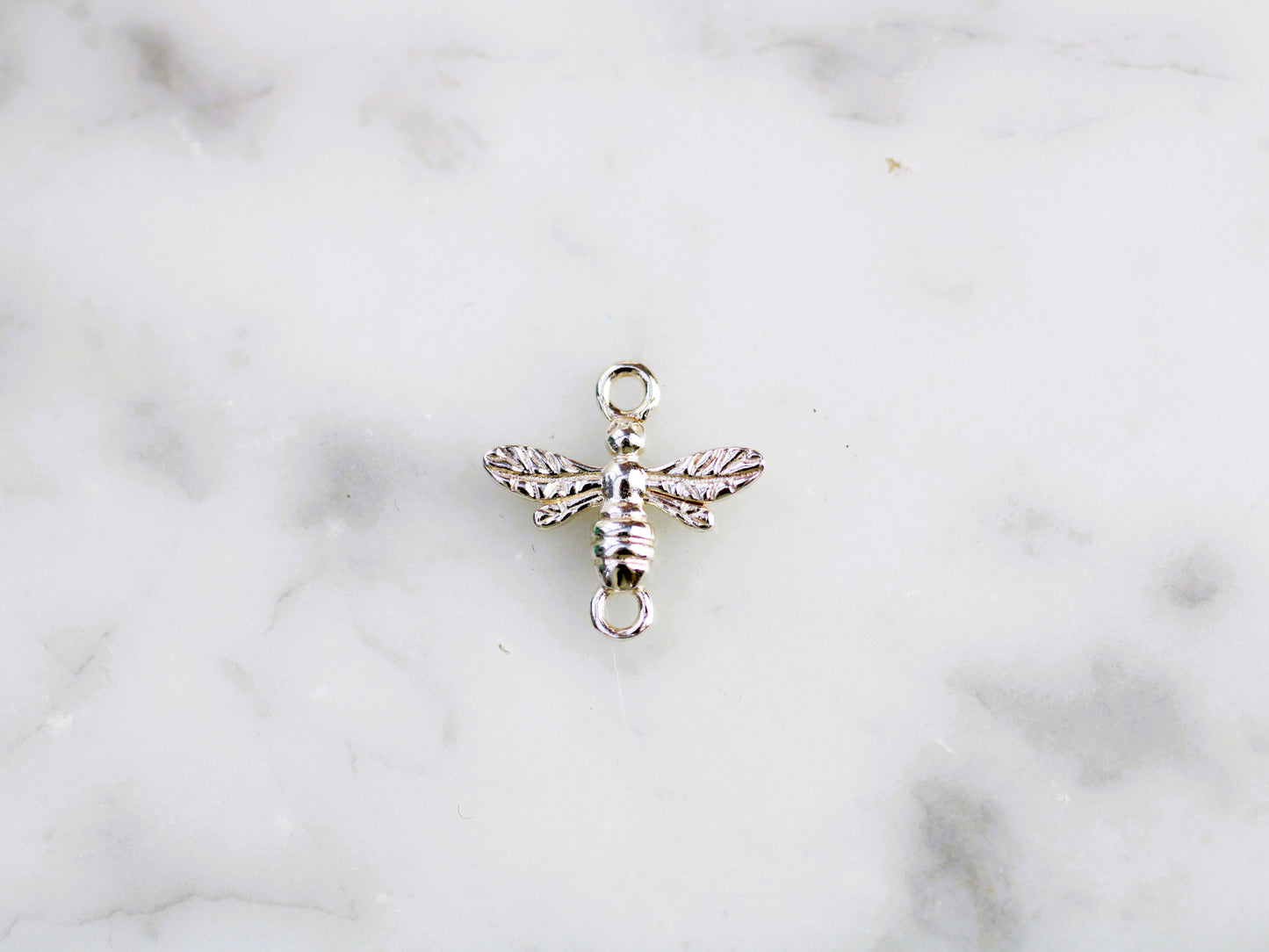 Bee connector in sterling silver.