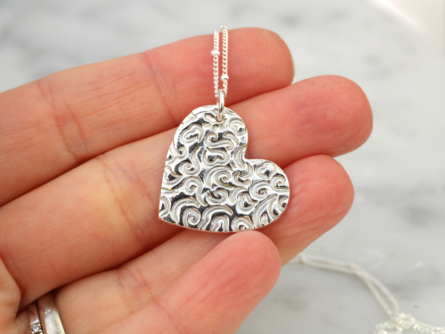 Pure silver heart pendant necklace.