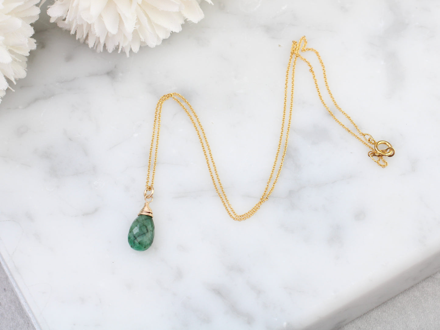 Emerald necklace in silver or gold.
