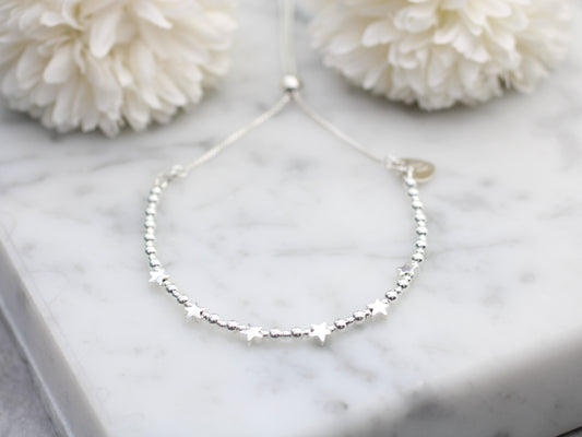 60th birthday bracelet. 60th birthday gift. Sterling silver star bracelet with slider clasp.
