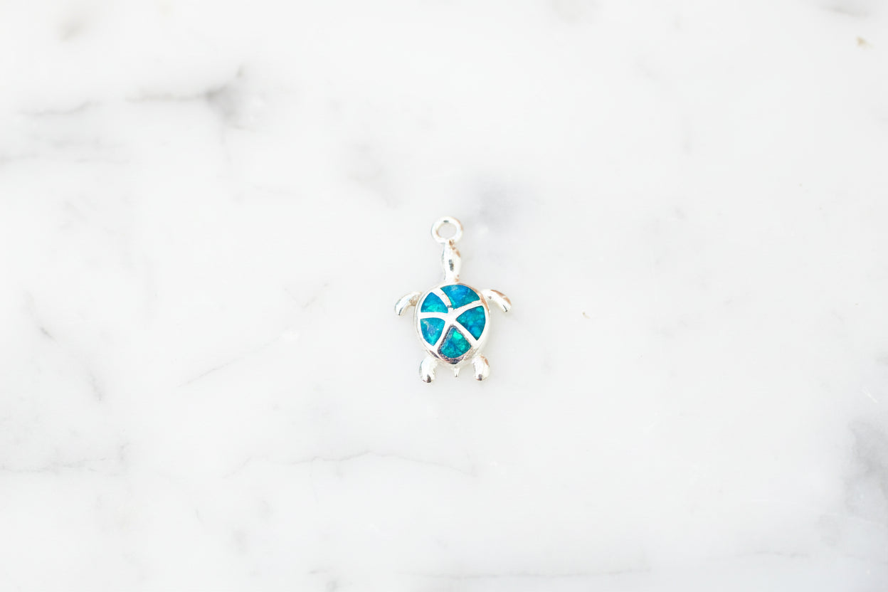 Blue opal turtle charm.