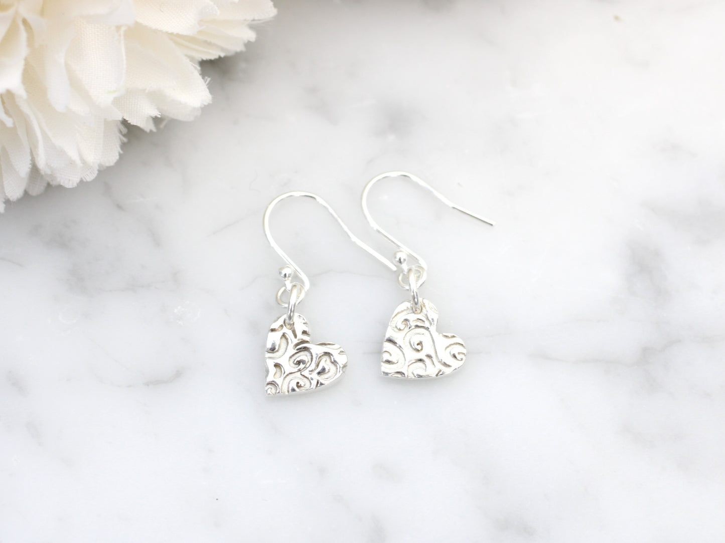 Heart drop earrings.