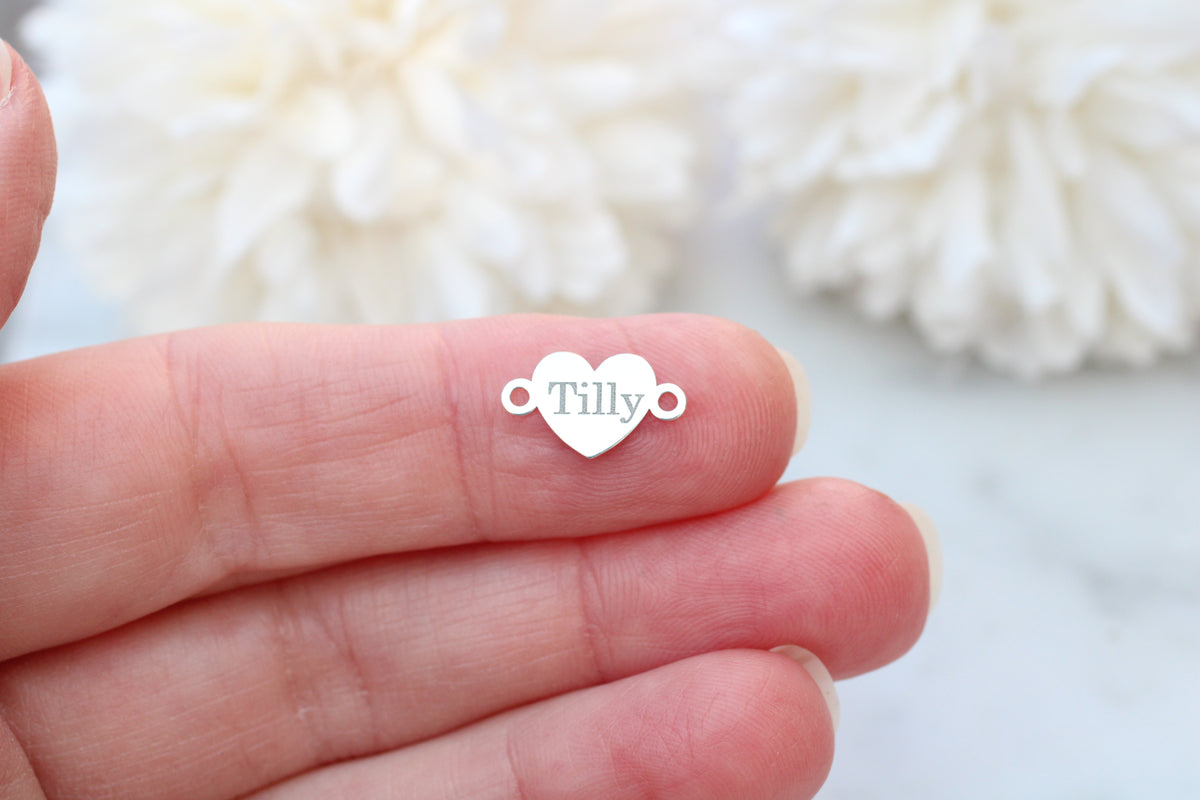 Engraved heart connector.