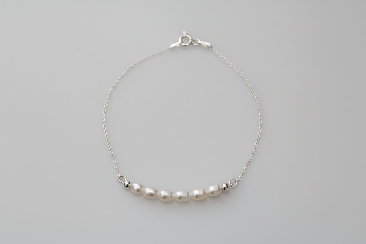 Pearl bracelet on a marble background